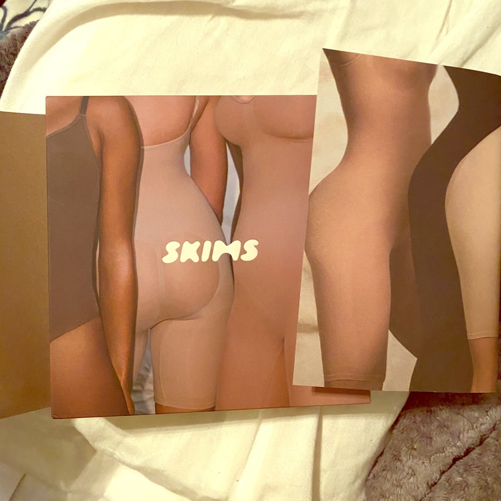 Skims sculpting body suit mid thigh